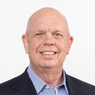 head shot of a man wearing a suit