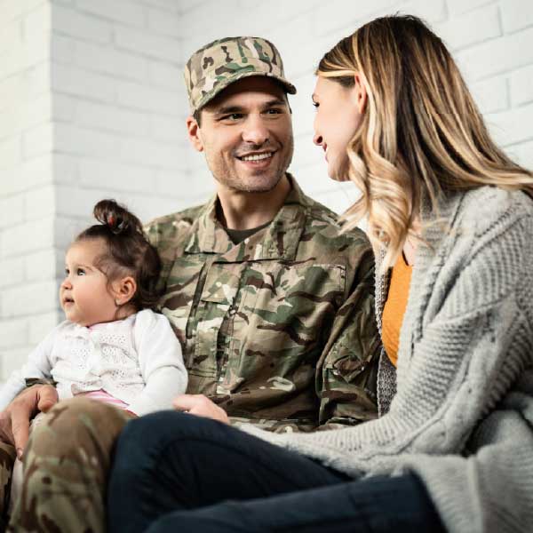 a man in a military uniform with a woman and a child